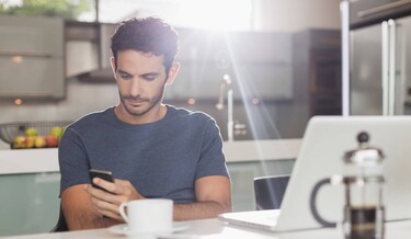 man scrolling on his phone